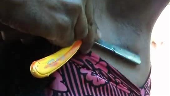 Indian girl shaving her armpits hair by a sharp edged straight razor smooth and clean ..avi